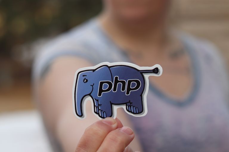 PHP elephant mascot sticker, blurred background.
